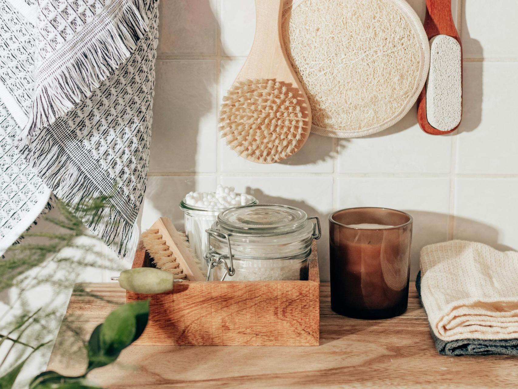 brown wooden chopping board beside clear glass jar