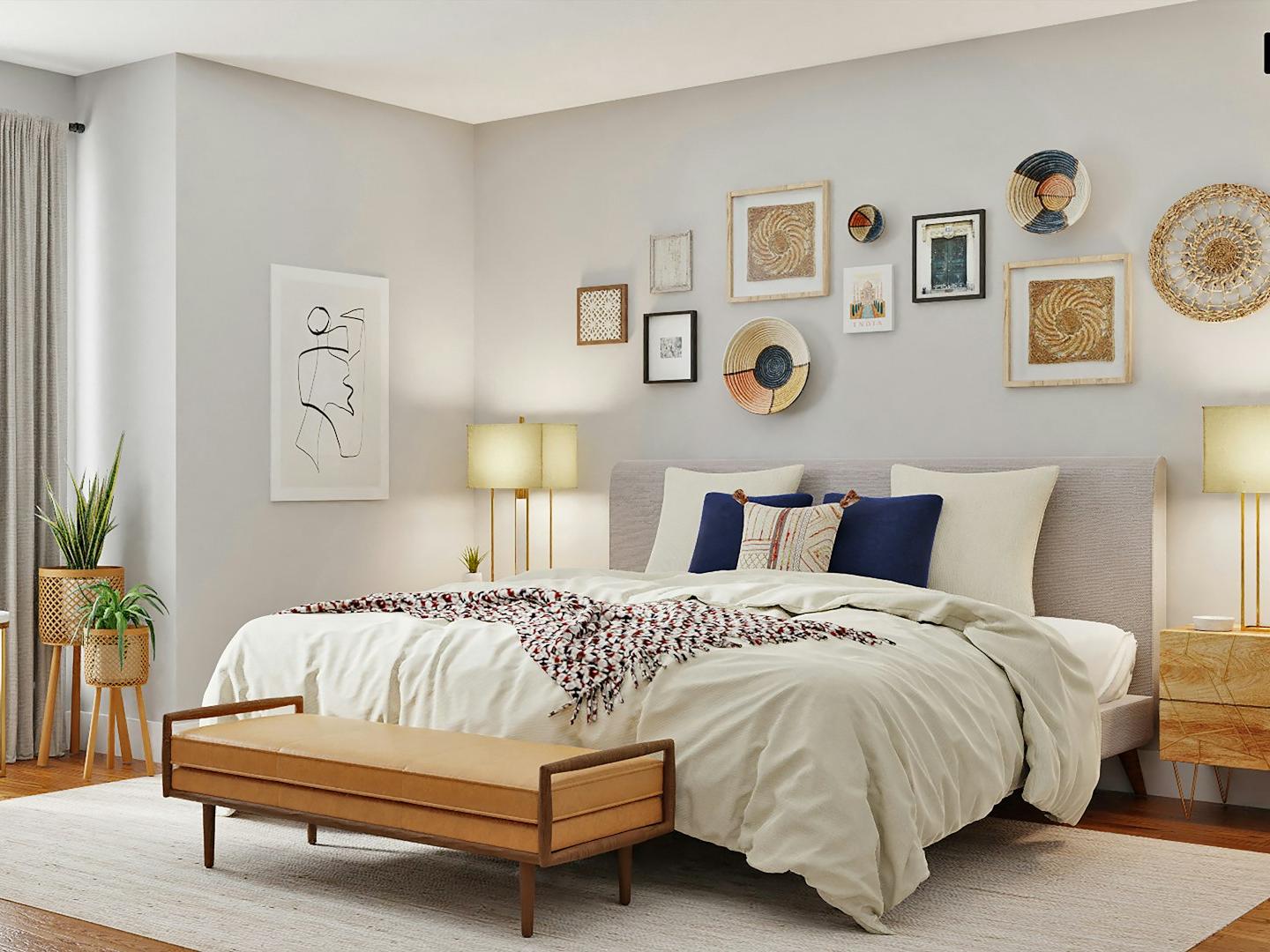 black laptop computer on white bed