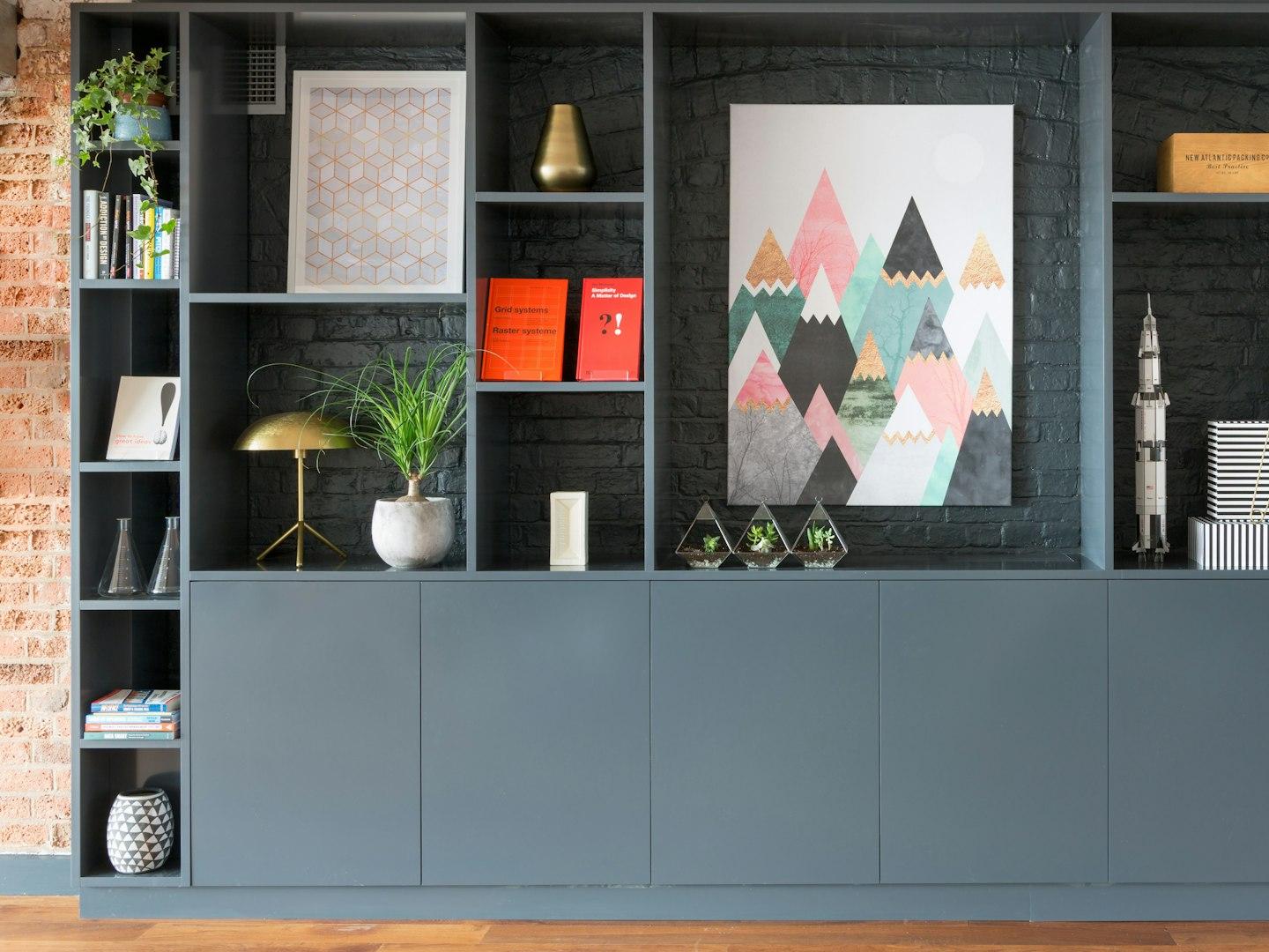 black wooden shelf with green plants